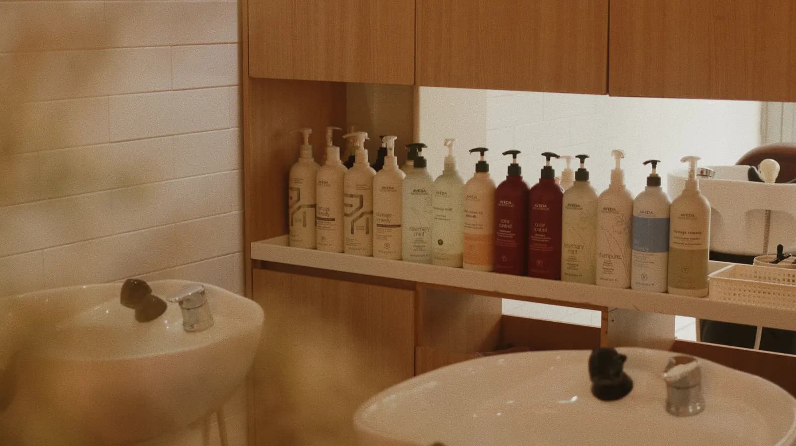 AVEDA haircare products on the salon shelves · RARIEN Myeongdong